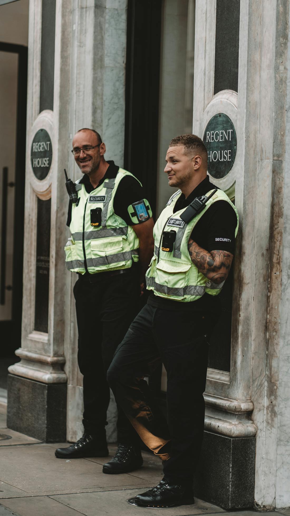 Uniformed security officers on duty at a building entrance