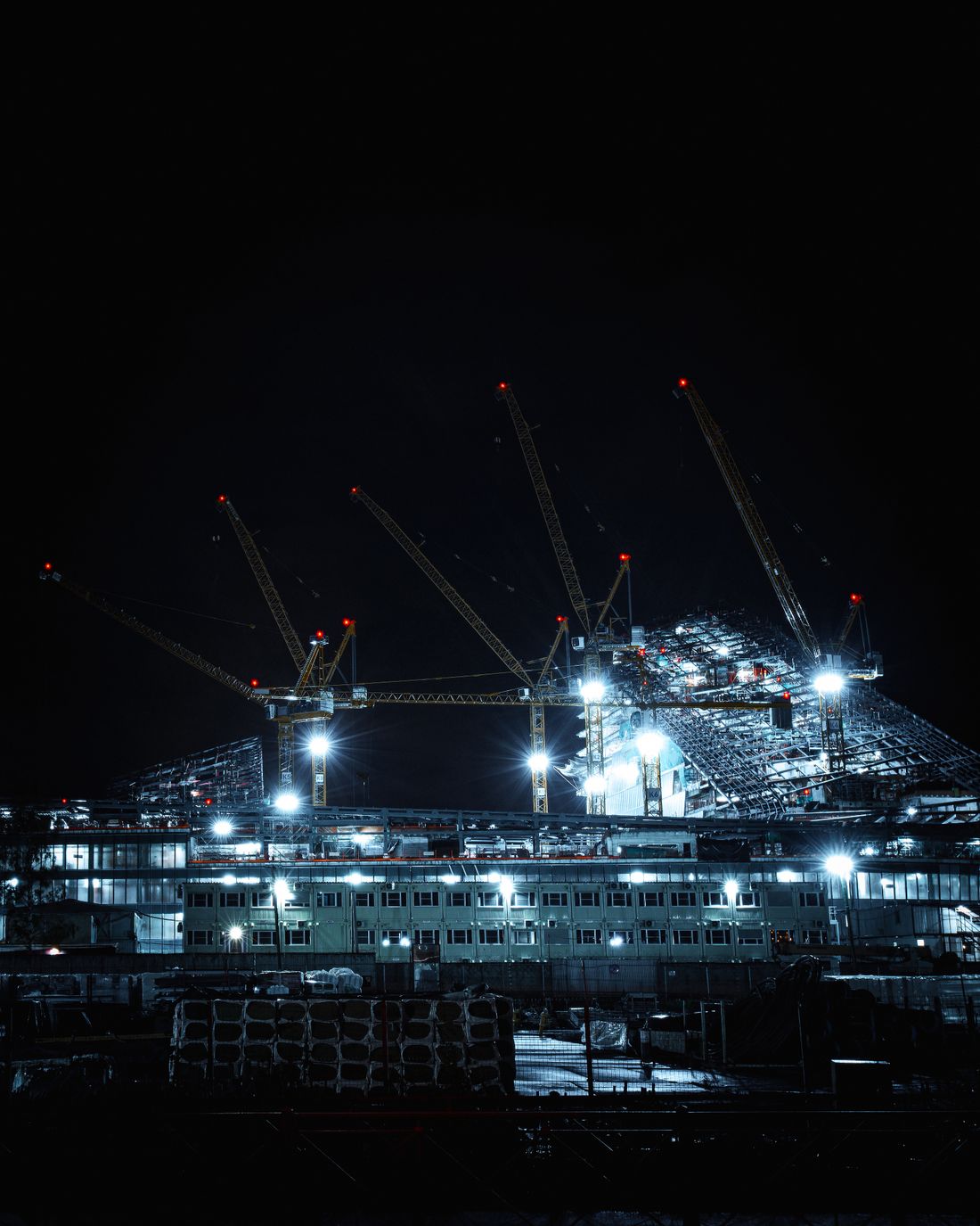 Illuminated site at night covered by mobile security patrols