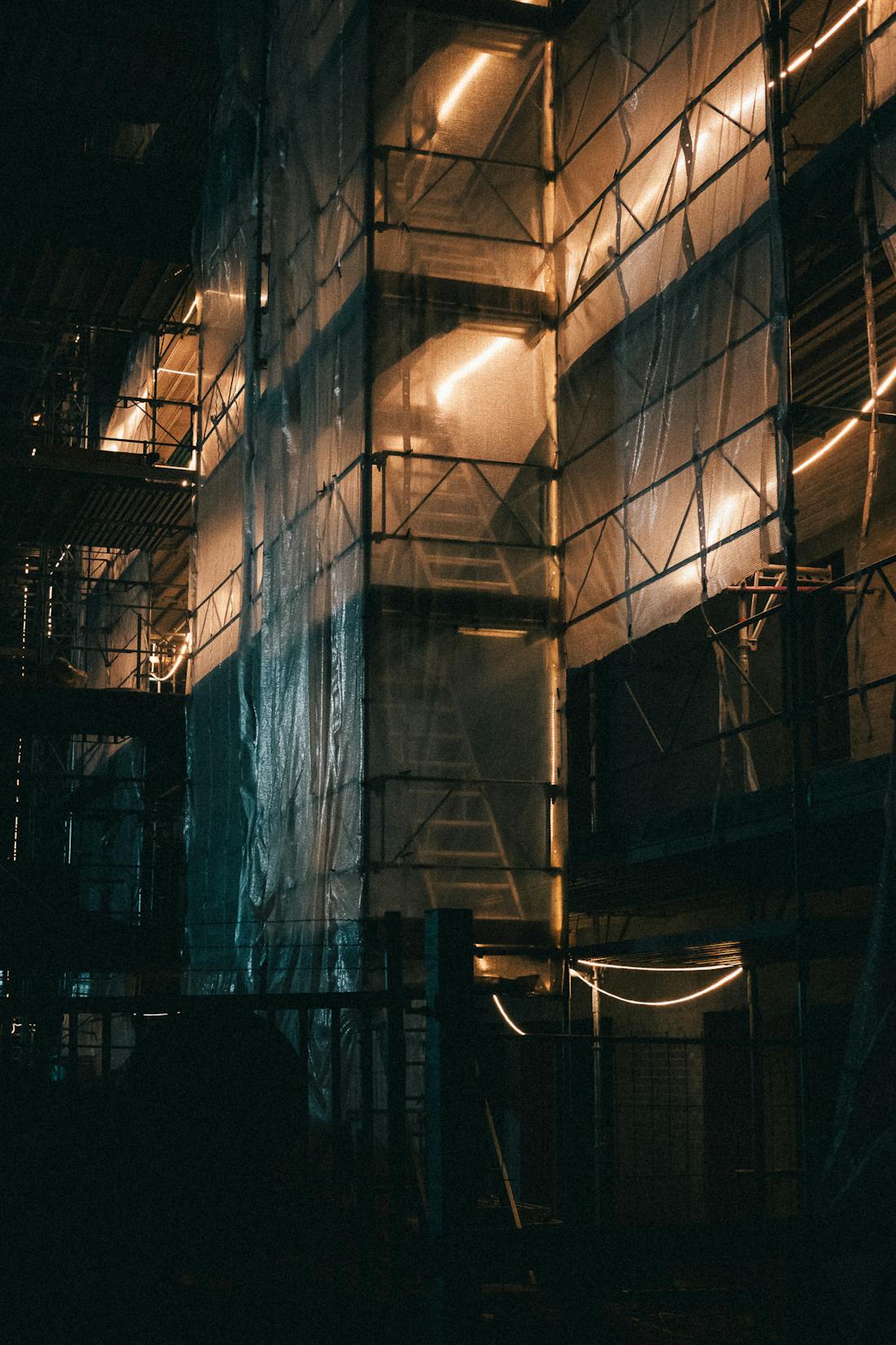 Construction site under scaffolding secured at night
